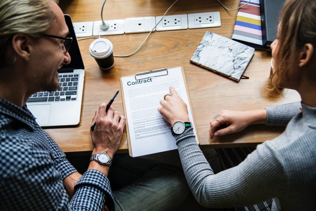 Business-People-Discussing-Contract